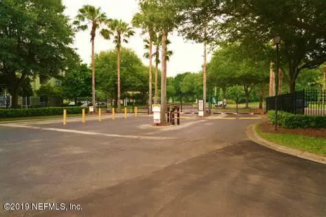 a kitchen with a refrigerator and a sink