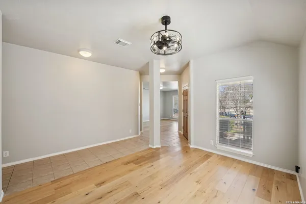 a view of an empty room with a window
