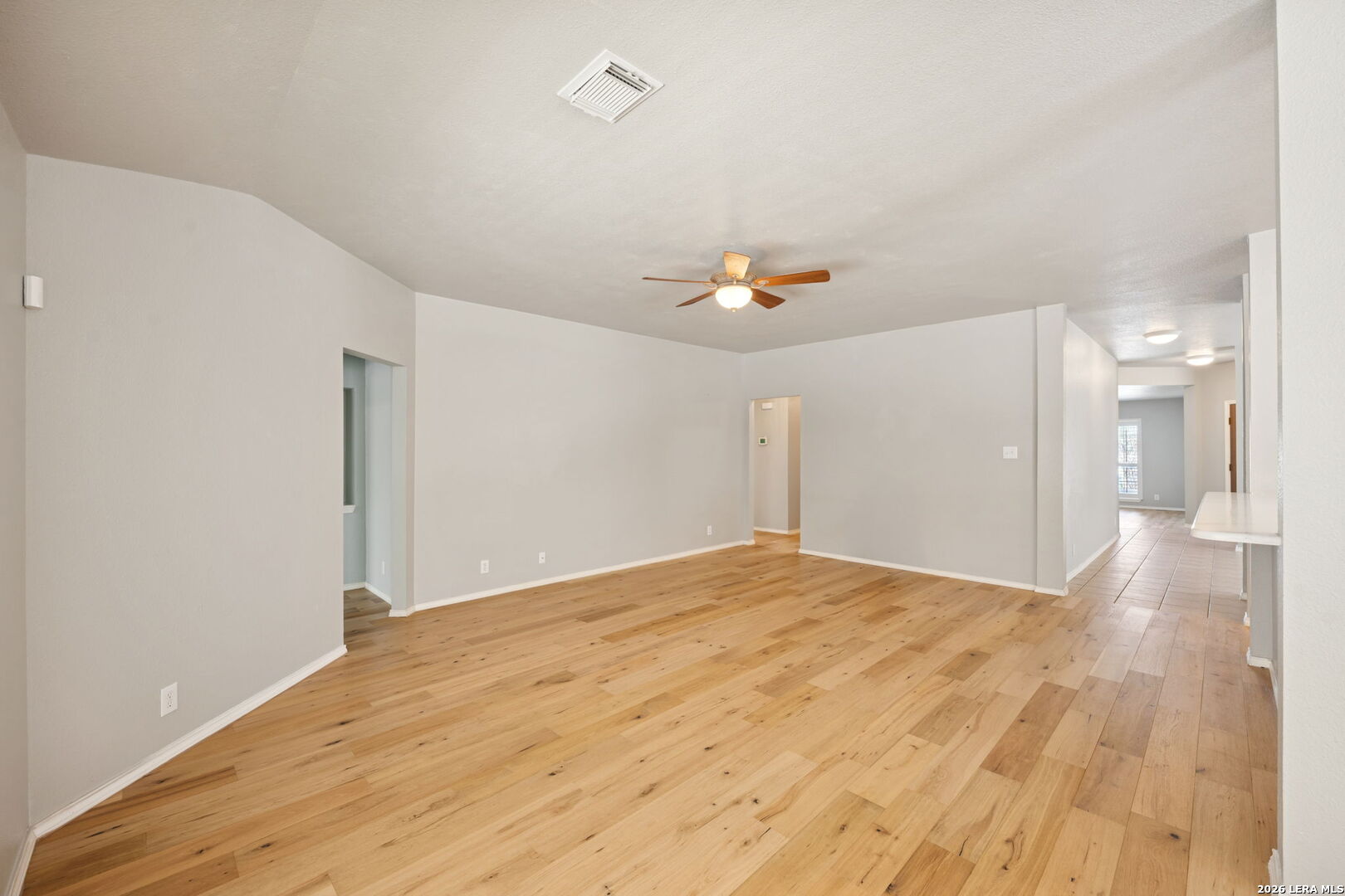 626 Rexton Lane San Antonio, TX 78258 - Photo 16 of 34 a view of empty room with wooden floor
