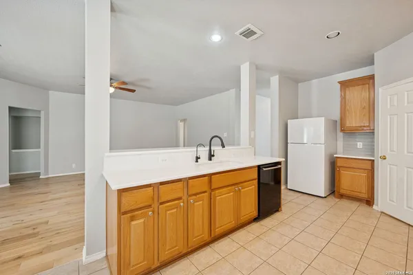 a kitchen with stainless steel appliances granite countertop a sink and cabinets