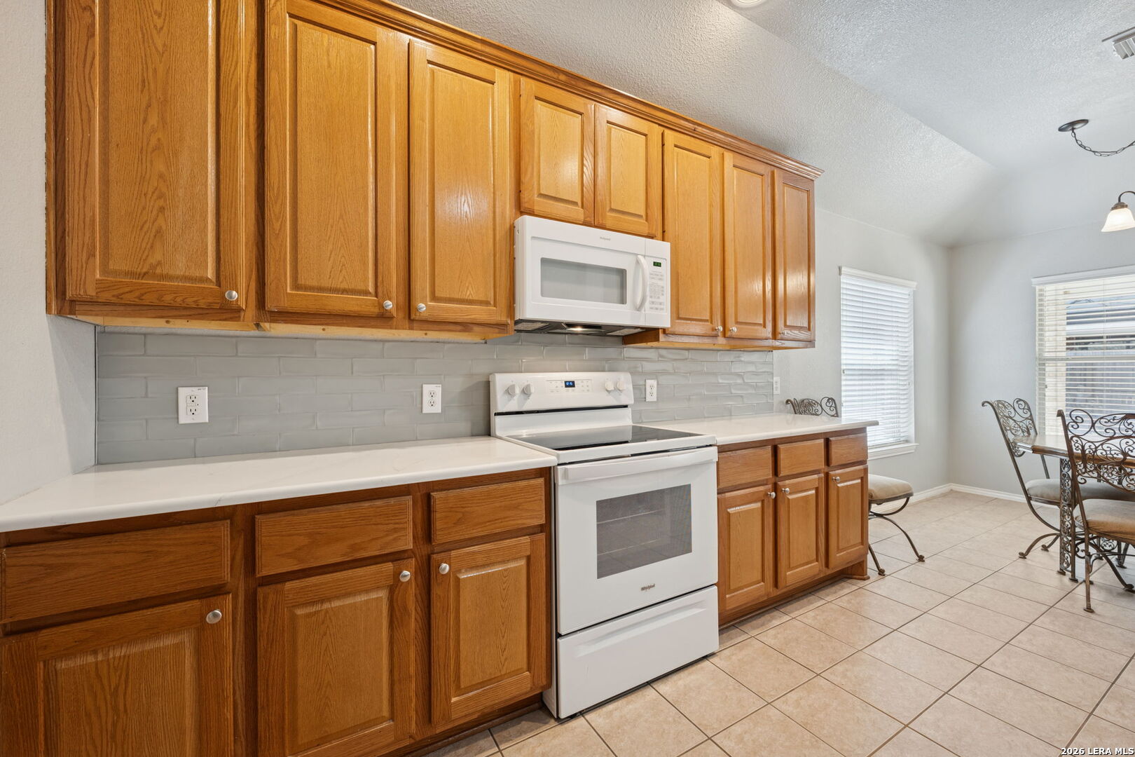 626 Rexton Lane San Antonio, TX 78258 - Photo 20 of 34 a kitchen with stainless steel appliances granite countertop a sink and cabinets