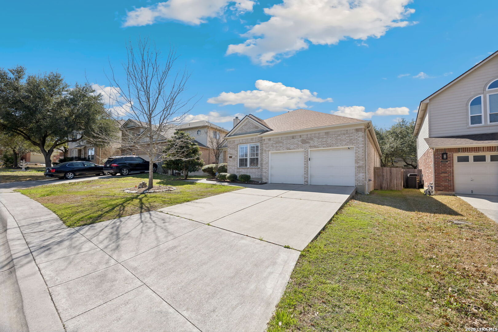626 Rexton Lane San Antonio, TX 78258 - Photo 4 of 34 a view of yellow house with swimming pool and yard
