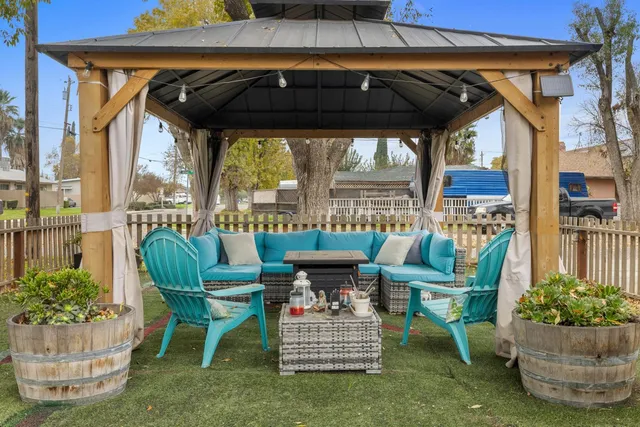 a view of a chair and table in the patio