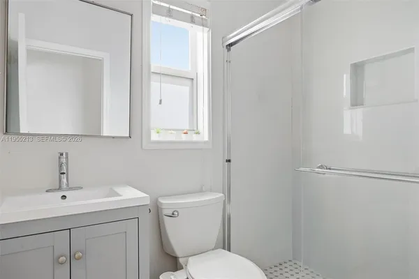 a view of a chairs and table in backyard of the house