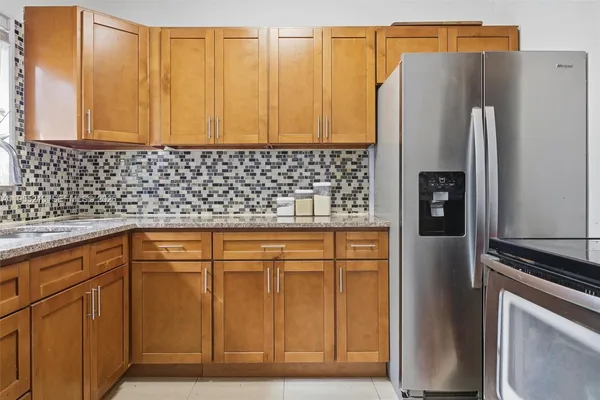 a kitchen with sink cabinets and window