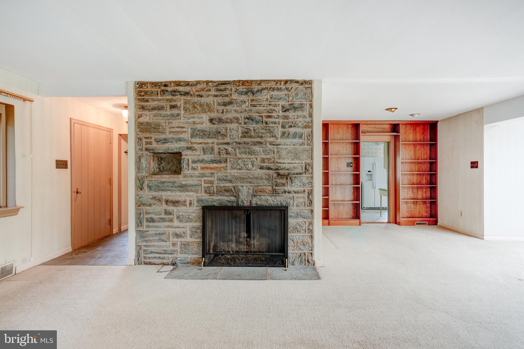 1307 Church Road Oreland, PA 19075 - Photo 9 of 28 Living room with fireplace and built-ins