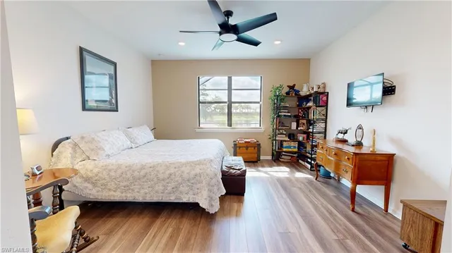 a bedroom with furniture and a window