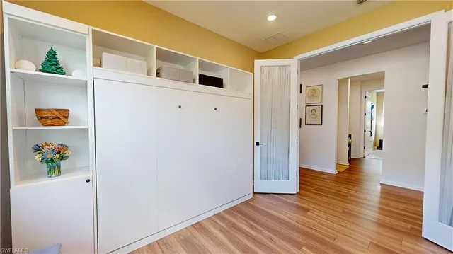 a view of an entryway with wooden floor