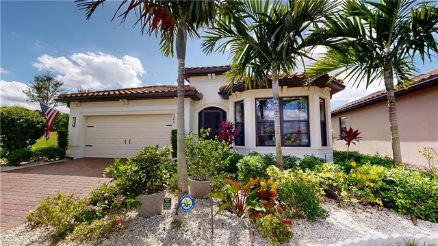 front view of a house with a flower garden