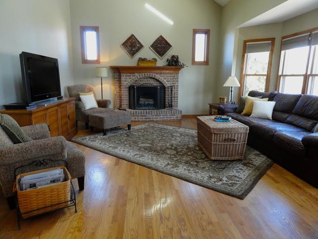 496 Lewis Road Geneva, IL 60134 - Photo 5 of 18 a living room with furniture and a fireplace