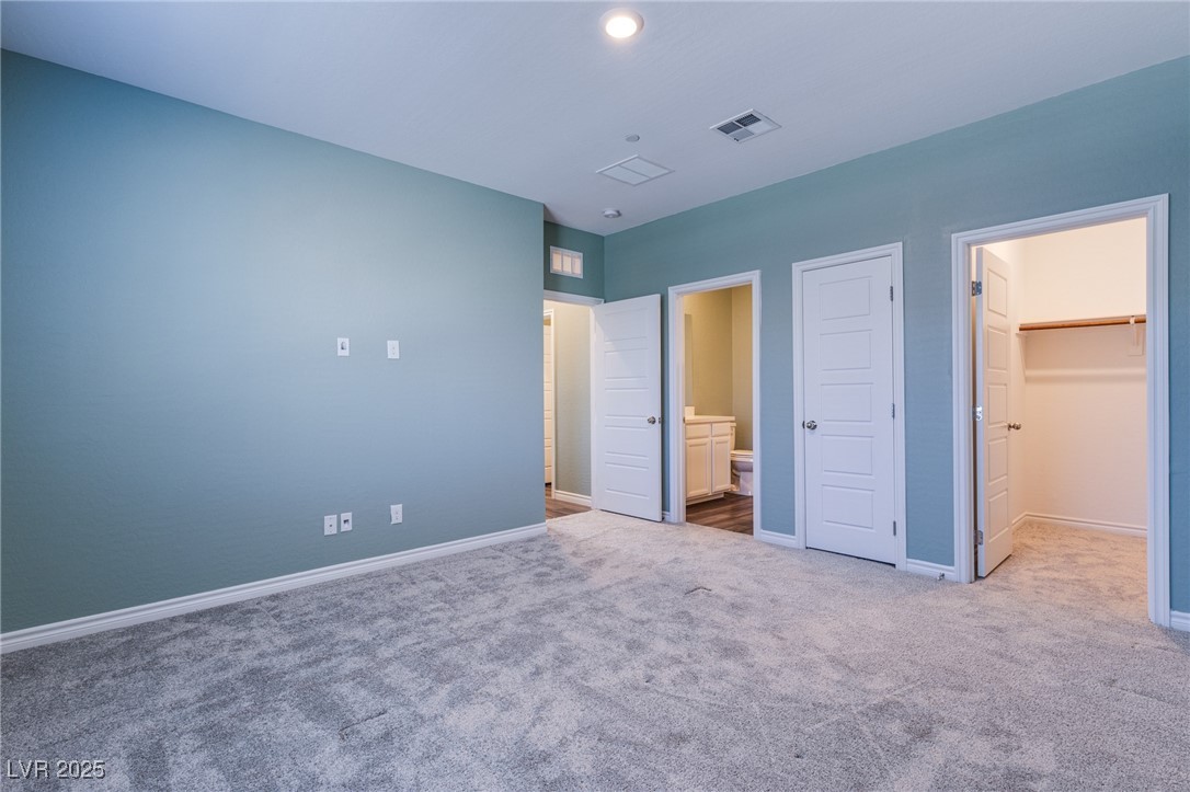 7336 North Decatur Boulevard, Unit 1 North Las Vegas, NV 89084 - Photo 15 of 39 VERY LARGE PRIMARY BEDROOM WITH SITTING AREA AND KING SIZE BED AND DRESSERS FIT EASILY