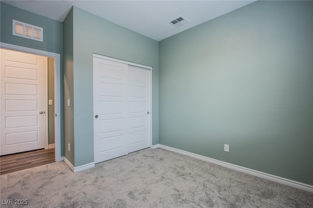 7336 North Decatur Boulevard, Unit 1 North Las Vegas, NV 89084 - Photo 21 of 39 Secondary Bedroom is larger than most with ample space for furniture.