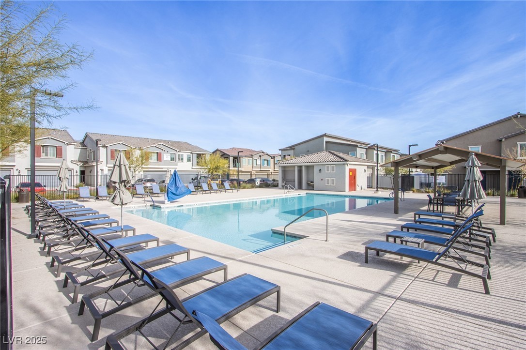 7336 North Decatur Boulevard, Unit 1 North Las Vegas, NV 89084 - Photo 34 of 39 Pool is just a short walk from the home. Showers and plenty of lounging space in this wonderfully large pool space.