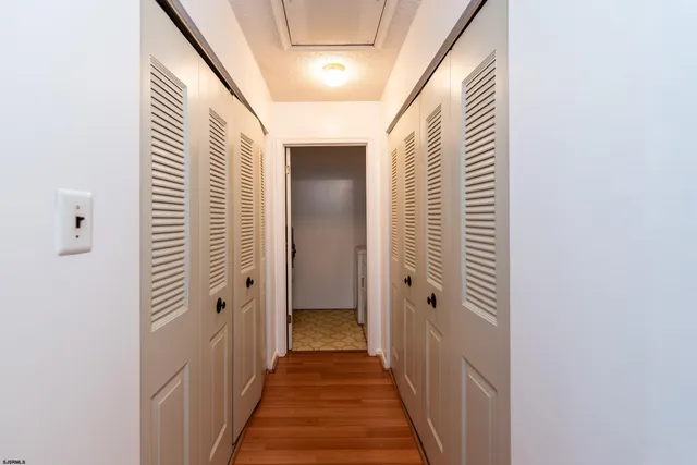 a view of a hallway with the wooden floor