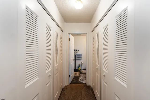 a view of a hallway with a window