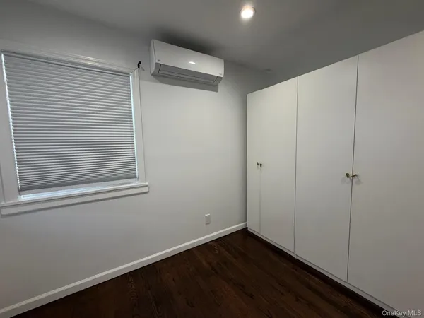 a white toilet sitting next to a bathroom sink and tub