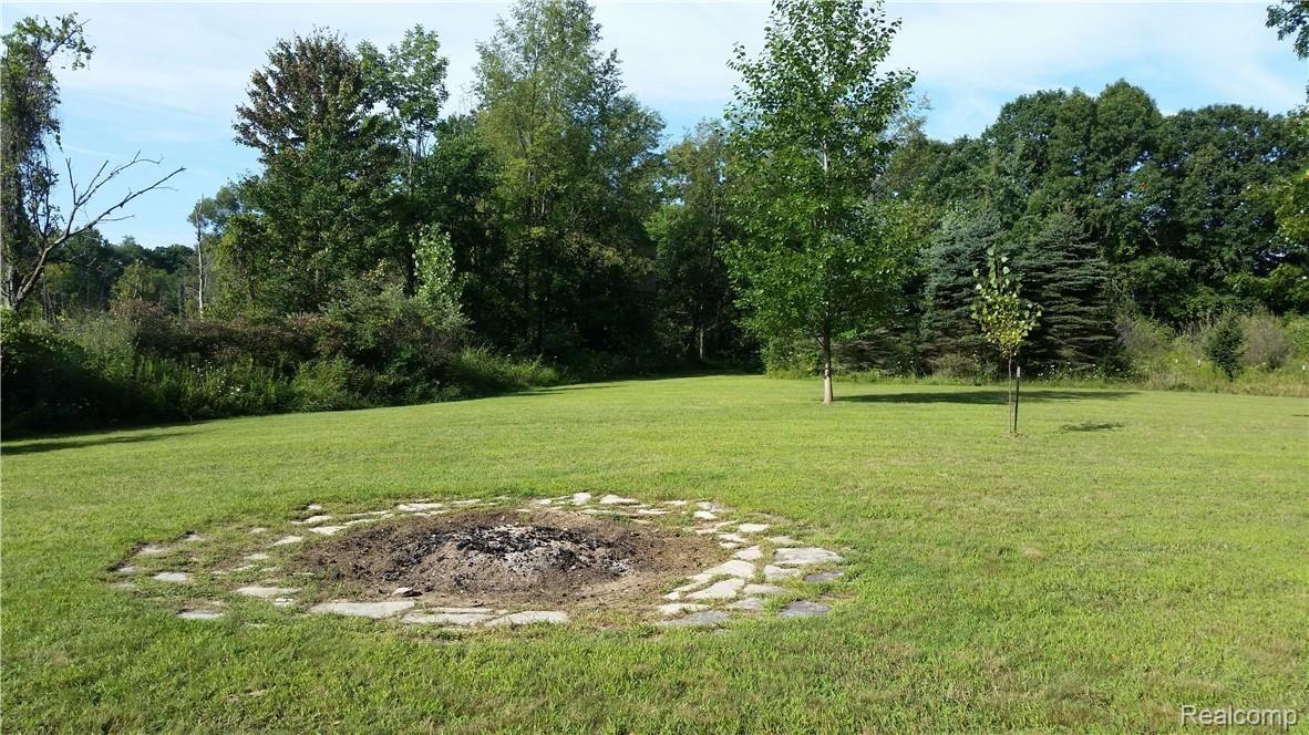 4760 Winding Way Howell, MI 48843 - Photo 54 of 59 Fire pit with Water Connection