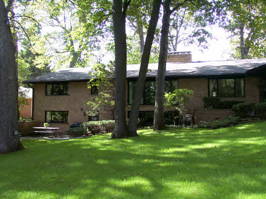 3915 Landstrom Road Rockford, IL 61107 - Photo 2 of 6 a view of a chair and table in backyard of the house