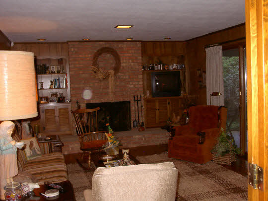 3915 Landstrom Road Rockford, IL 61107 - Photo 4 of 6 a living room with furniture and a fireplace