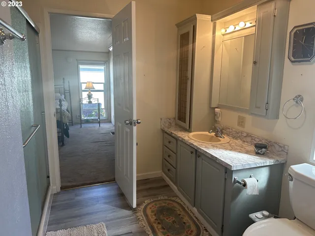 a bathroom with a sink toilet and shower