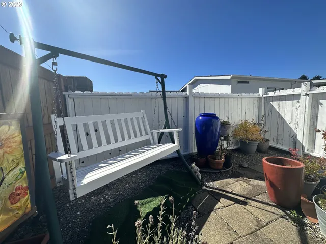 a living room with furniture and a ceiling fan