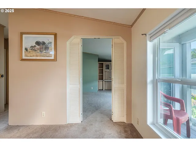 a view of a livingroom with furniture and a ceiling fan