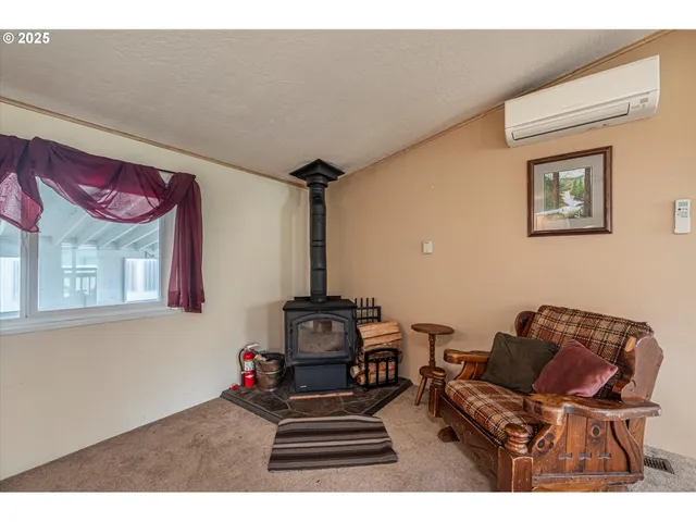 a kitchen view with wooden floor and electronic appliances