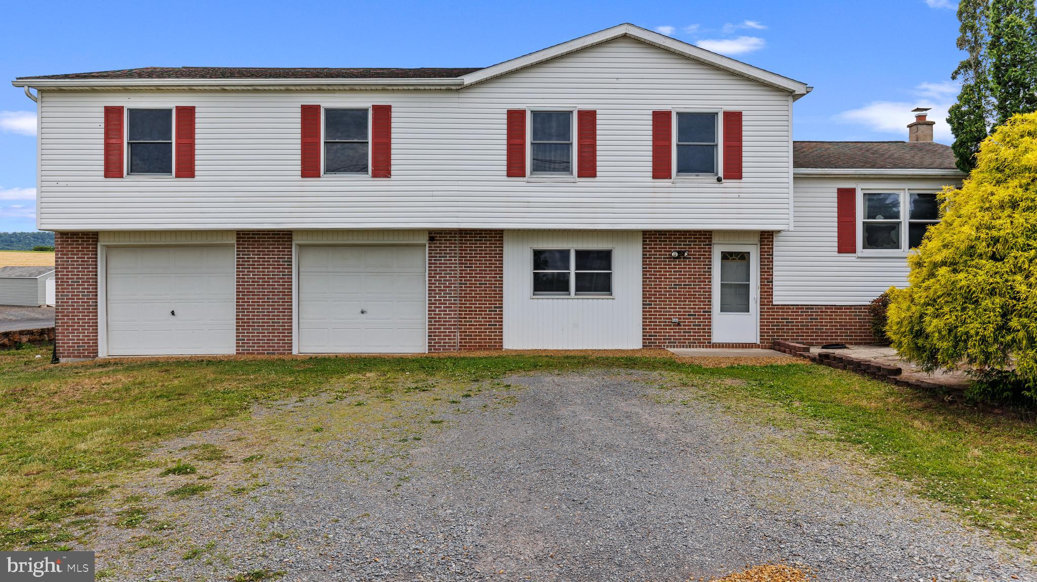 25 Powells Valley Road Halifax, PA 17032 - Photo 2 of 21 a front view of a house with a yard and garage