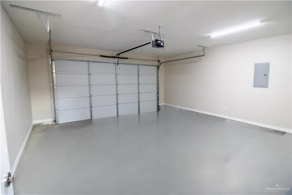 a aerial view of a house with a garden and entryway