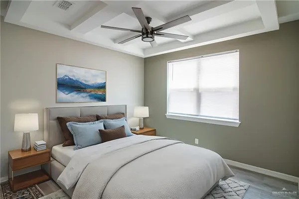 a bedroom with a bed and a painting on the wall