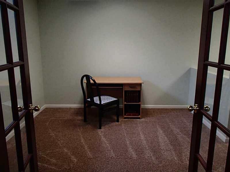 3018 Meyeridge Road Pittsburgh, PA 15209 - Photo 22 of 25 Den. Large room with a partial dividing wall, great for a home office, gym, or play room.