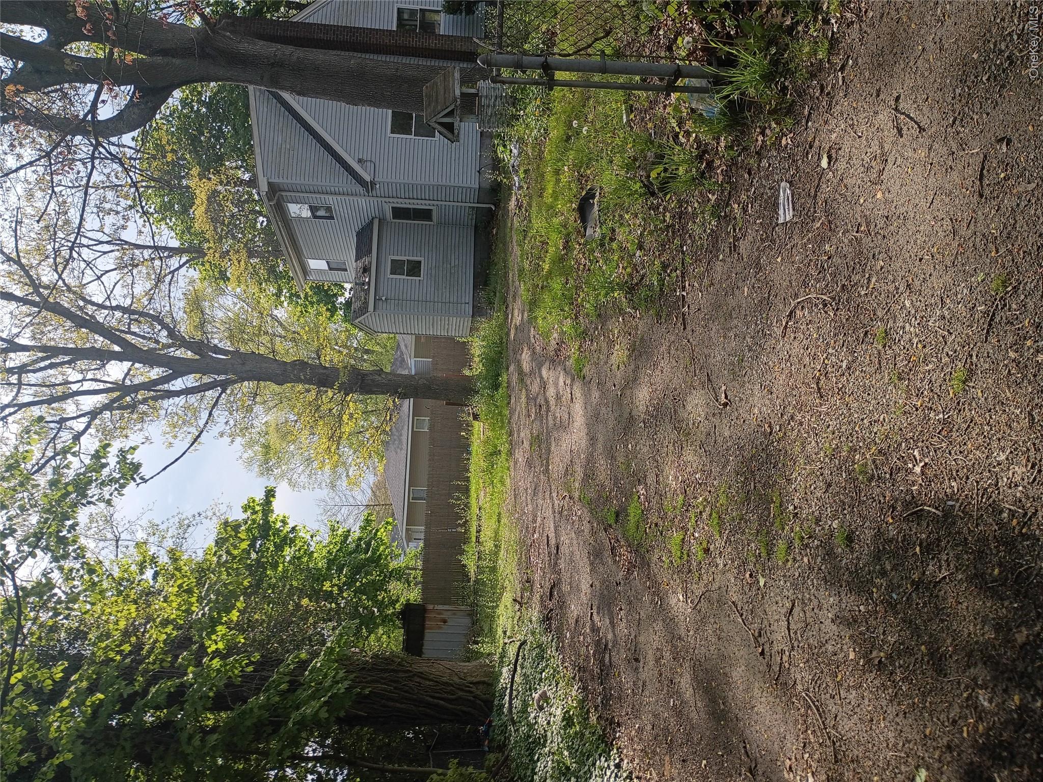 16 Neighborhood Road Mastic Beach, NY 11951 - Photo 4 of 4 a backyard of a house with lots of green space