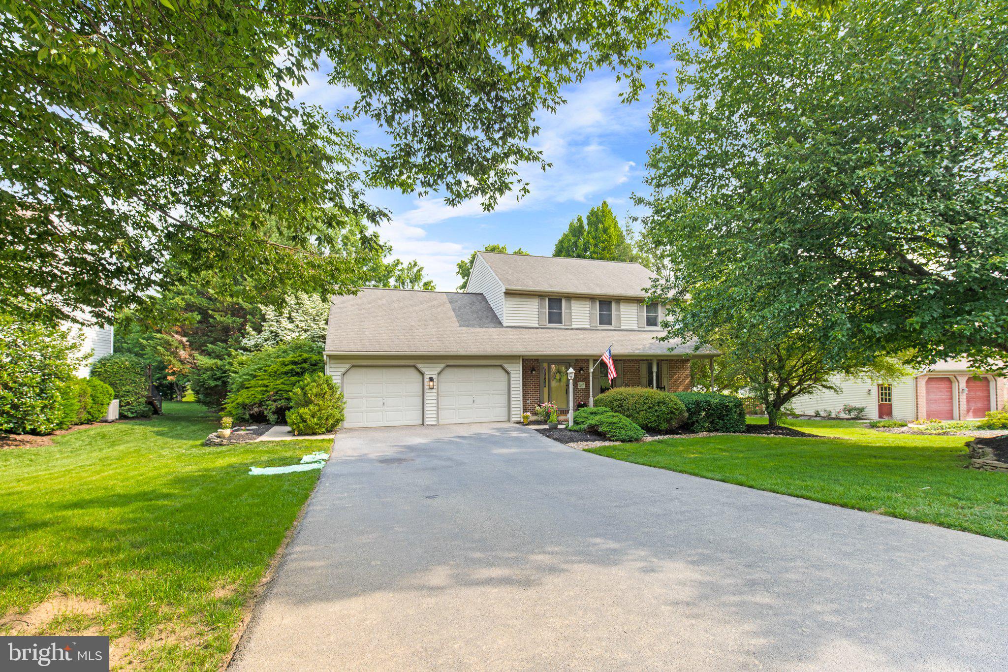1024 Shadowstone Drive Lancaster, PA 17603 - Photo 2 of 28 a front view of a house with a garden