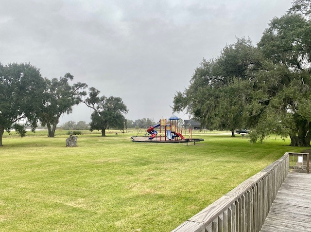 218 Cattle Drive Trail Angleton, TX 77515 - Photo 20 of 34 While on the dock, you can keep an eye out on your children nearby at the playground.
