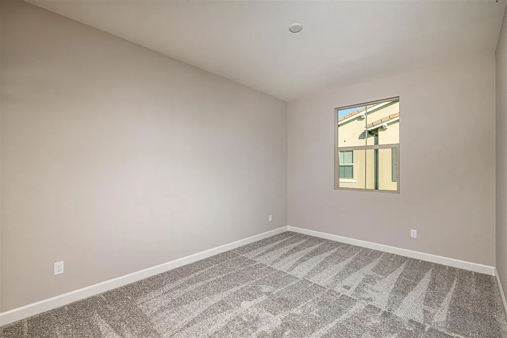 1182 Delpy View Point, Unit 106 Vista, CA 92084 - Photo 12 of 16 a view of room with window