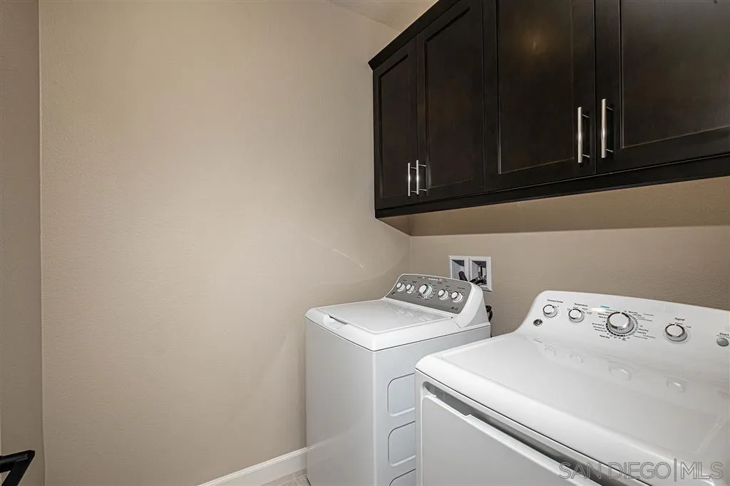 1182 Delpy View Point, Unit 106 Vista, CA 92084 - Photo 14 of 16 a utility room with dryer and washer