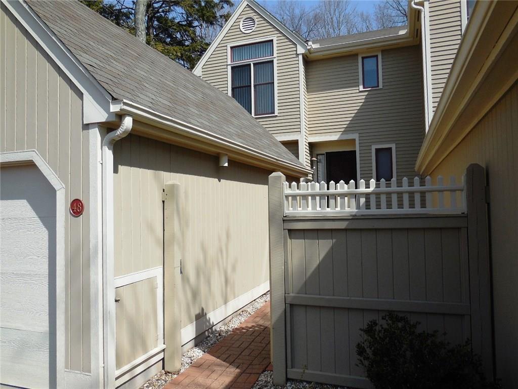 48 Sylvan Ridge, Unit 48 Middlefield, CT 06481 - Photo 1 of 1 a front view of a house with deck