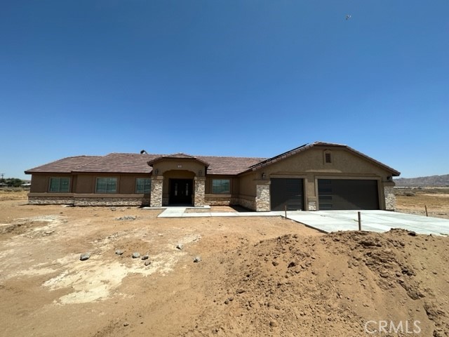 21130 South Road Apple Valley, CA 92307 - Photo 1 of 1 a front view of a house with a yard