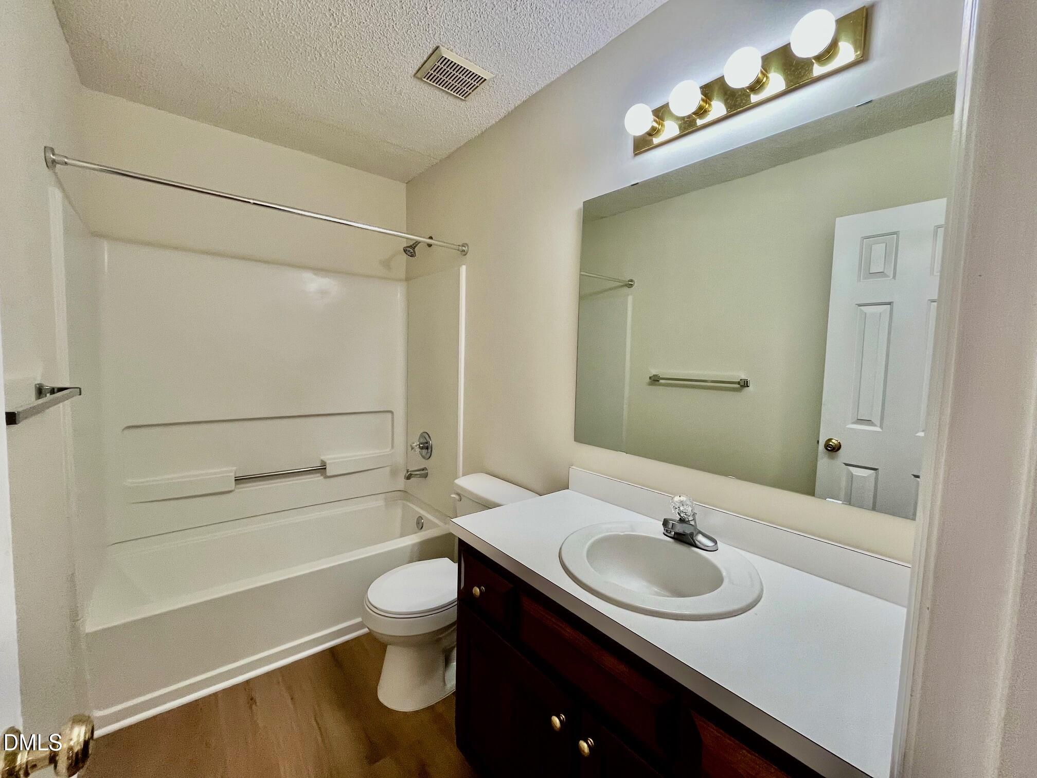 5413 Passenger Place Raleigh, NC 27603 - Photo 14 of 16 a bathroom with a sink and a mirror