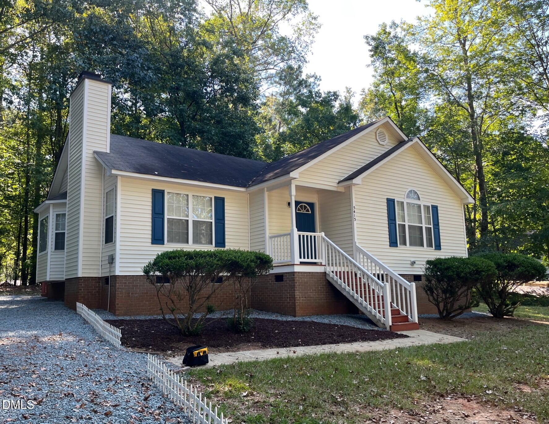 5413 Passenger Place Raleigh, NC 27603 - Photo 2 of 16 a front view of house with yard and green space