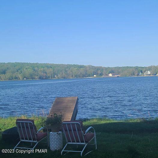11 Cheilo Path Pocono Lake, PA 18347 - Photo 13 of 20 a view of a lake with table and chair