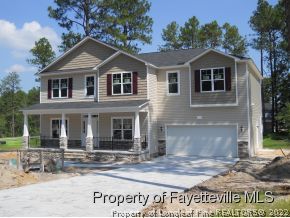 712 Sun Road Aberdeen, NC 28315 - Photo 3 of 6 a front view of a house with garden