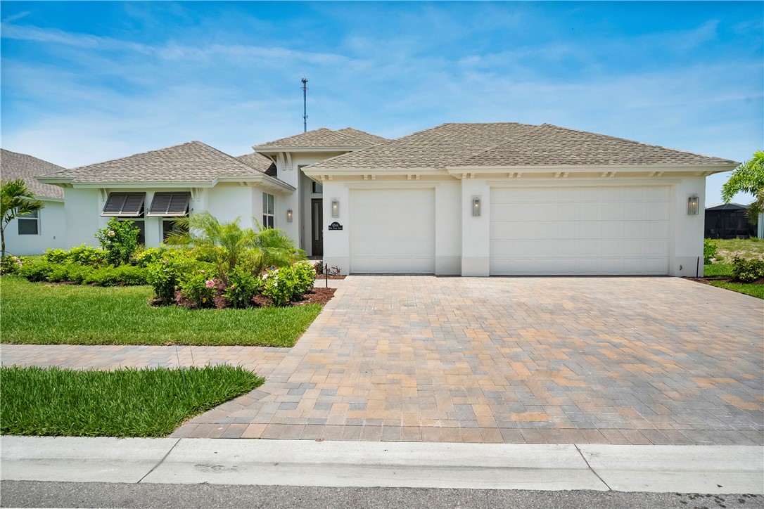 6344 High Pointe Circle Vero Beach, FL 32967 - Photo 2 of 26 a front view of a house with a garden