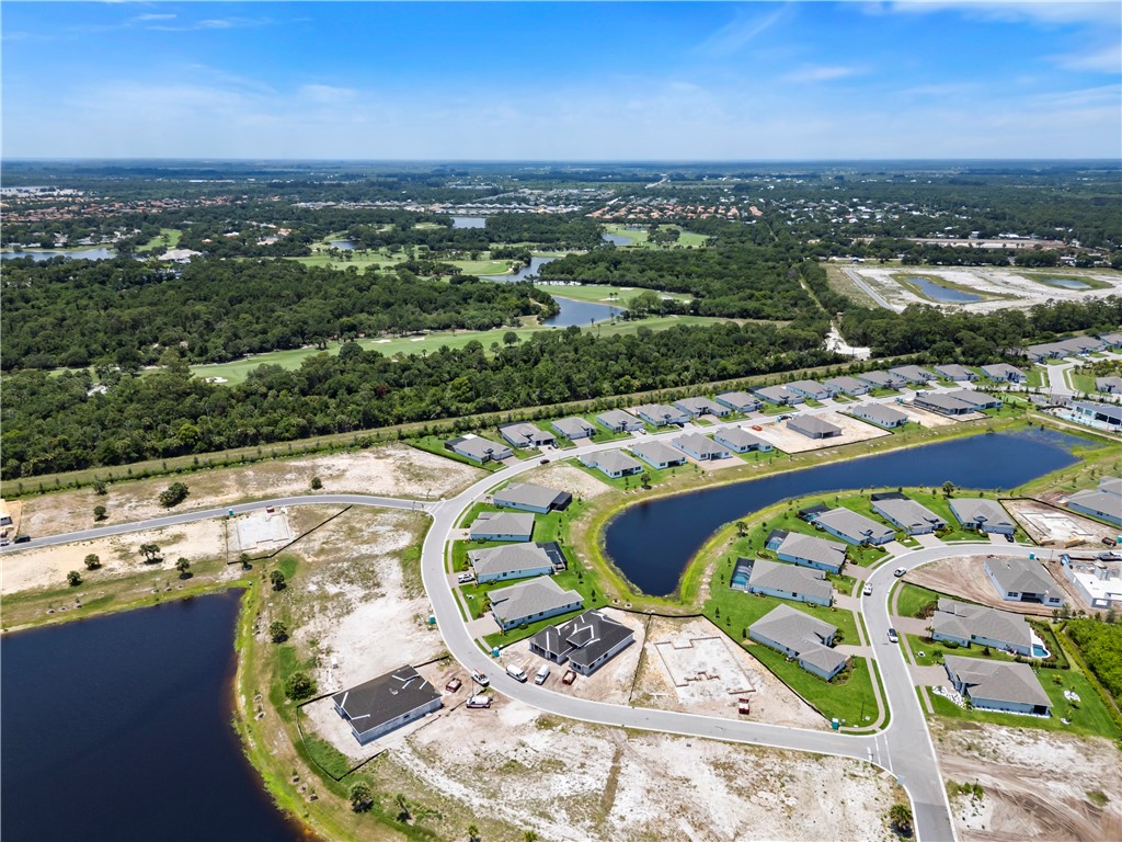 6344 High Pointe Circle Vero Beach, FL 32967 - Photo 25 of 26 an aerial view of a swimming pool with lawn chairs