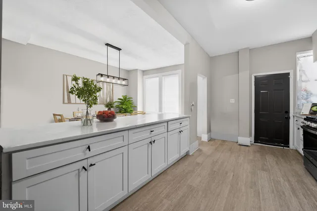 a spacious bathroom with a double vanity sink and a mirror