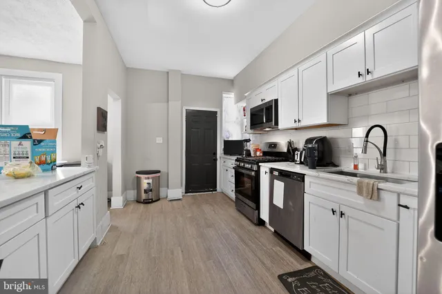 a view of a dining room with furniture and window