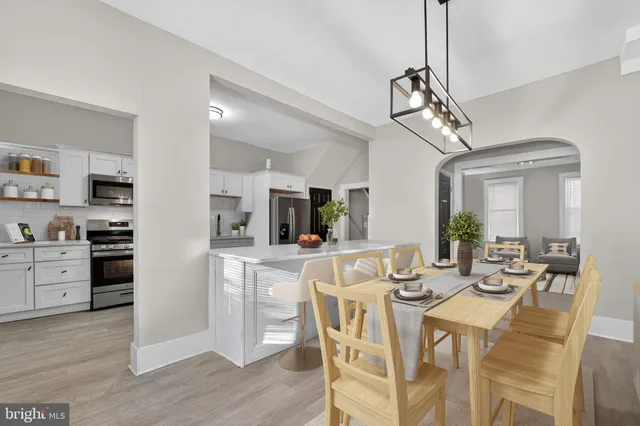 a kitchen with a table and chairs in it
