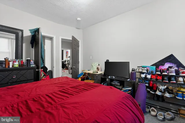 a bedroom with a bed and closet