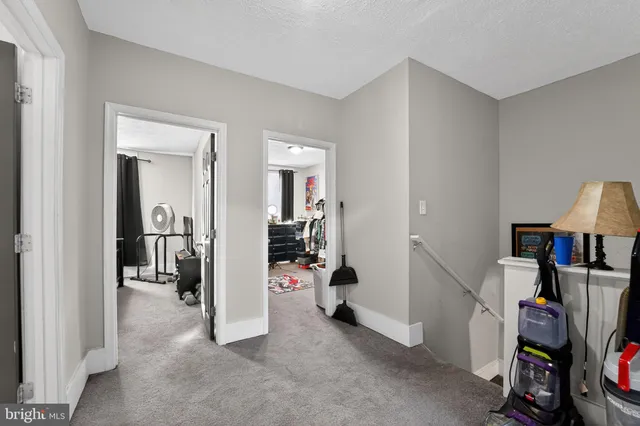 a view of walk in closet with clothes