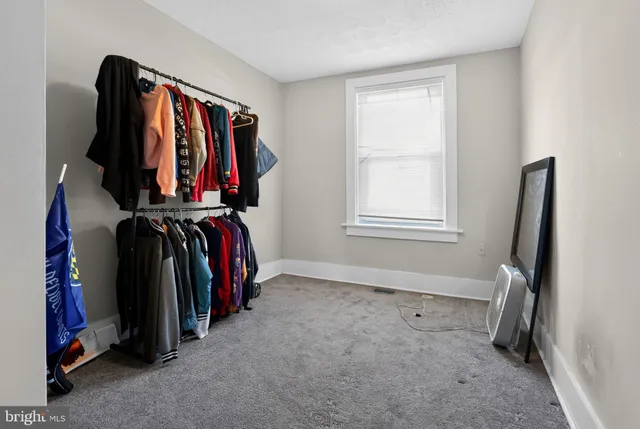 a view of a house with a small yard